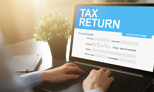 Online tax return application on screen. Business and finance concept.