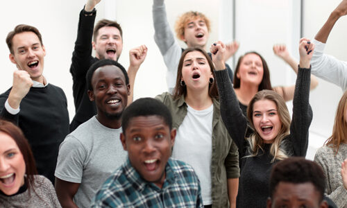 group of happy young people celebrating their success.